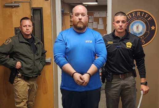 Andrew Hedrick escorted to police cruiser