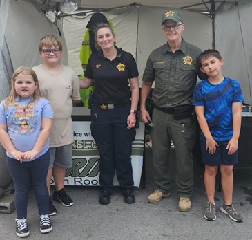 Special Deputy Elizabeth Sparks and Public Affairs Deputy Gilbert Acciardo with some special visitors at the LSO Informational Booth Chicken_festival_day_2_sept_27-2024: https://www.clayconews.com/