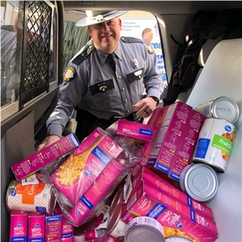 Trooper cramming KSP cruiser with food for KY families