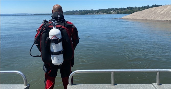 Multnomah County Sheriffs Office diver prepares to enter the river