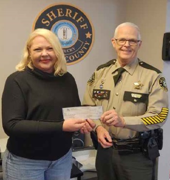 Donation-Robin Rose, manager of Ott's General Store and Deputy Gilbert Acciardo: https://www.clayconews.com/